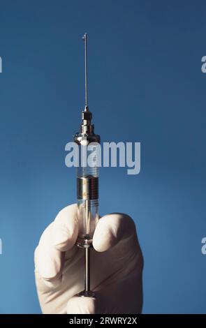 Scary old syringe made of glass and with a thick needle Stock Photo