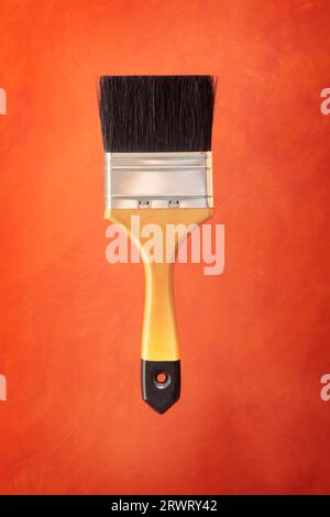 Paint brush on red background Stock Photo