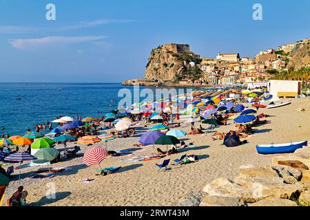 The city of Scilla Calabria Italy. Leisure time at Marina Grande beach in summer and the Ruffo Castle Stock Photo