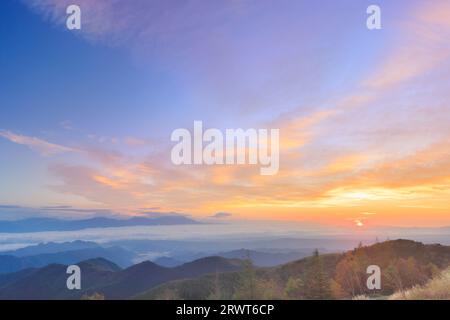 Mt. Asama and the morning glow and sunrise from near Utsukushigahara Open-Air Museum Stock Photo