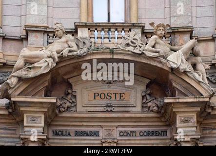 The pediment above the entrance to the main post office in Milan, Milano, Lombardy, Italy, Europe Stock Photo