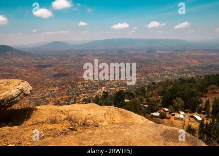 Scenic view of rock formations against valley and mountains in Mbooni Forest, Makueni County, Kenya Stock Photo