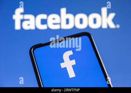 Stuttgart, Germany - July 20, 2023: Facebook logo social media on a mobile phone and computer screen in Stuttgart, Germany. Stock Photo