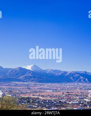 Yamanashi Prefecture Landscapes Peach blossoms in the city of Yamanashi and Mt. Fuji in the distance The unnamed observatory Stock Photo