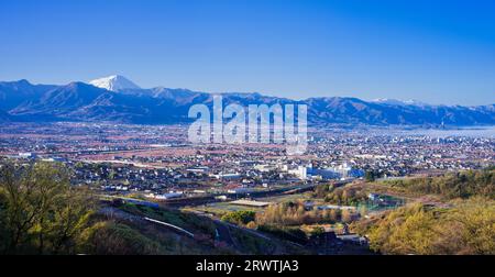 Yamanashi Prefecture Landscapes Peach blossoms in the city of Yamanashi and Mt. Fuji in the distance The unnamed observatory Stock Photo