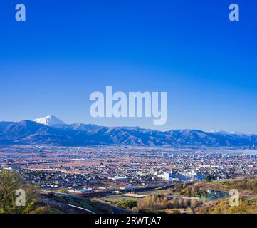 Yamanashi Prefecture Landscapes Peach blossoms in the city of Yamanashi and Mt. Fuji in the distance The unnamed observatory Stock Photo