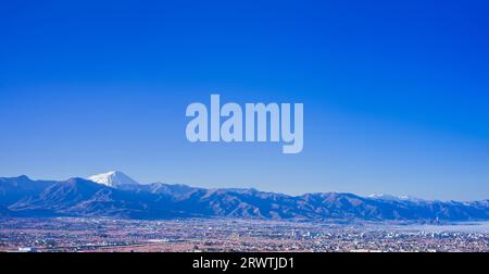 Yamanashi Prefecture Landscapes Peach blossoms in the city of Yamanashi and Mt. Fuji in the distance The unnamed observatory Stock Photo