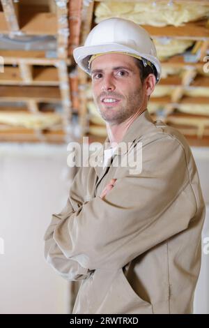 optimistic worker builder man posing looking at the camera Stock Photo