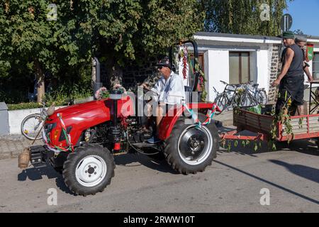 Traditional Hungarian harvest parade on September 16, 2023 in village Tapolca-Diszel of Hungary. Traditional hungarian clothes. Stock Photo