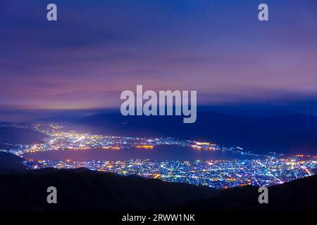 Lake Suwa and night view from Takabotchi Plateau Stock Photo