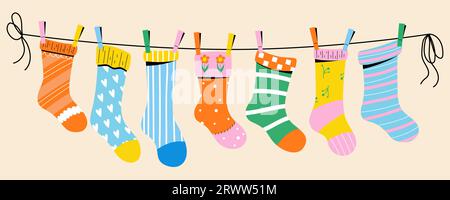 Colorful children socks with textures and patterns drying on the clothesline. Vector illustration. Stock Vector