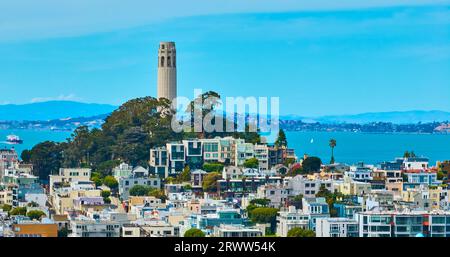 Coit Tower on Telegraph Hill aerial overlooking San Francisco Bay with houses and apartments Stock Photo