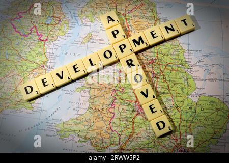 Development Approved spelled out in Scrabble letters and words on a map of England - local development and building control Stock Photo