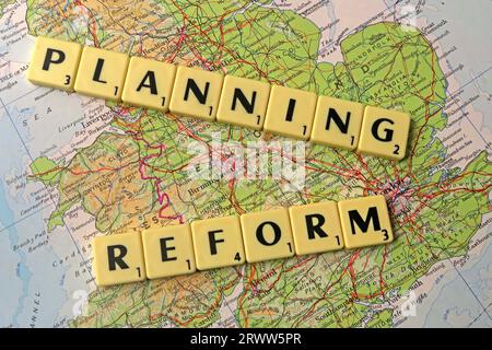 Planning Reform spelled out in Scrabble letters and words on a map of England - local development and building control Stock Photo