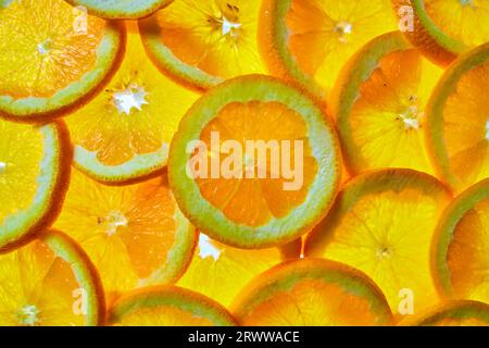 Pile of orange slices created wall of orange in background asset Stock Photo