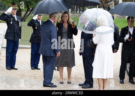Britain King Charles III, speaks with President of the French National Assembly Yael Braun-Pivet and France's Senate President Gerard Larcher, as he leaves with his wife Queen Camilla, after addressing Senators and members of the National Assembly at the French Senate, the first time a member of the British Royal Family has spoken from the Senate Chamber, in Paris on September 21, 2023. Britain's King Charles III and his wife Queen Camilla are on a three-day state visit starting on September 20, 2023, to Paris and Bordeaux, six months after rioting and strikes forced the last-minute postponeme Stock Photo