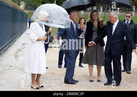 Britain King Charles III, speaks with President of the French National Assembly Yael Braun-Pivet and France's Senate President Gerard Larcher, as he leaves with his wife Queen Camilla, after addressing Senators and members of the National Assembly at the French Senate, the first time a member of the British Royal Family has spoken from the Senate Chamber, in Paris on September 21, 2023. Britain's King Charles III and his wife Queen Camilla are on a three-day state visit starting on September 20, 2023, to Paris and Bordeaux, six months after rioting and strikes forced the last-minute postponeme Stock Photo