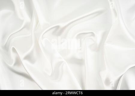 Closeup of rippled white silk fabric lines Stock Photo