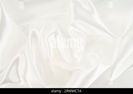 Closeup of rippled white silk fabric lines Stock Photo