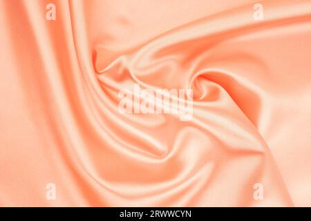Orange fabric texture background, detail of silk or linen pattern. Stock Photo