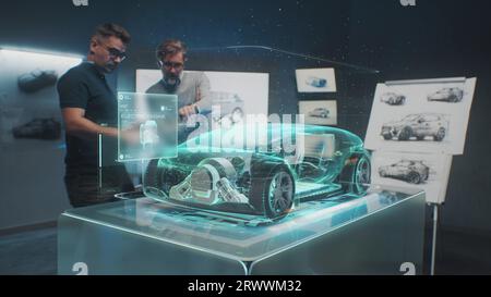 Two professional automotive engineers choose body of new eco-friendly electric car using futuristic augmented reality hologram. 3D computer graphics of vehicle high-tech developing. VFX animation. Stock Photo