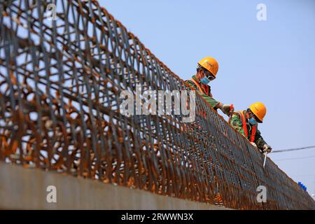 luannan county, China - June 16, 2023: Construction workers working on bridge construction sites, North China Stock Photo