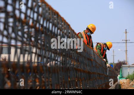 luannan county, China - June 16, 2023: Construction workers working on bridge construction sites, North China Stock Photo