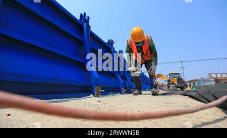 luannan county, China - June 16, 2023: Construction workers working on bridge construction sites, North China Stock Photo