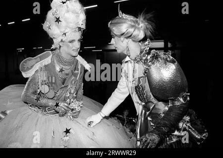 Andrew Logan dressed as half man half woman, artist and organiser of the Alternative Miss World a pansexual beauty pageant competition. Seen here with the winning contestant Miss Aldershot - Michael Haynes, back stage at the Grand Hall, Olympia, West London England 1981. 1980s UK HOMER SYKES Stock Photo