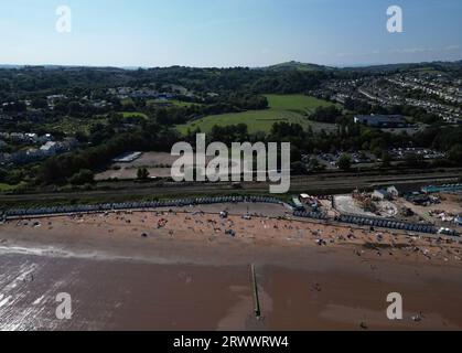 Goodrington Sands, Torbay, South Devon, England: DRONE VIEWS: Sunbathers on the sandy beach on a hot, summer day. Torbay is a popular UK summer resort. Stock Photo