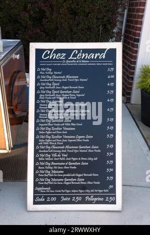 A large menu board for Chez Lenard showing 14 different varieties of hot dog for sale. On Main Street in Ridgefield, Connecticut. Stock Photo