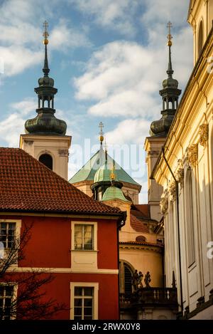 Conical, helmet and onion domes of the Wallachian Chapel and Cathedral of Saint Clement in Old Town central Prague, Czechia. Stock Photo