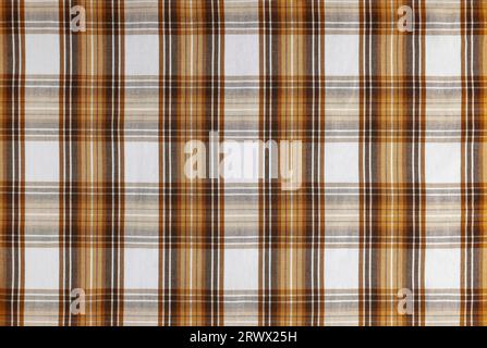 Orange checkered texture fabric, tartan pattern. Shirt fabric, tablecloth textile, linen plaid cloth, classic scottish check pattern. Backdrop, wallpa Stock Photo