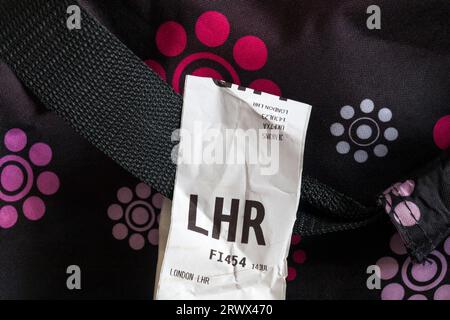 IcelandAir luggage label stuck on case for LHR London Heathrow airport in England UK Stock Photo