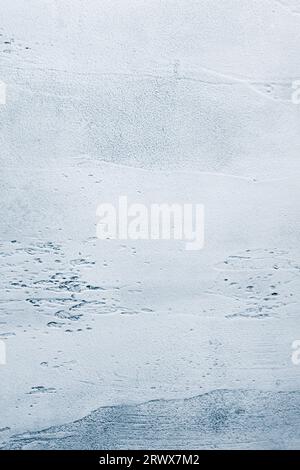 Light blue textured concrete background with light base darker in the recesses. Abstract texture for graphic design or wallpaper, top view Stock Photo