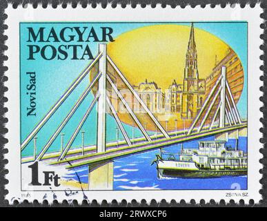 Cancelled postage stamp printed by Hungary, that shows Danube bridge in Novi Sad, Serbia, circa 1985. Stock Photo