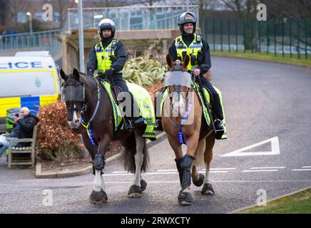 The police and mounted police units out in force to keep rival fans separate as they arrive at the Amex Stadium before the premier football league match Brighton and Hove Albion and Crystal Palace 15th March 2023 Stock Photo