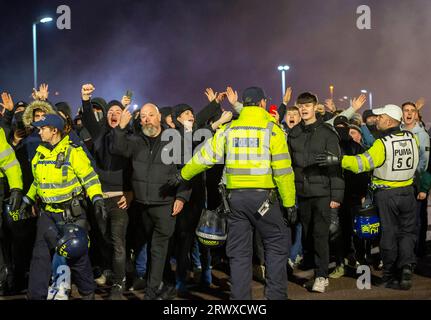 The police and mounted police units out in force to keep rival fans separate as they arrive at the Amex Stadium before the premier football league match Brighton and Hove Albion and Crystal Palace 15th March 2023 Stock Photo