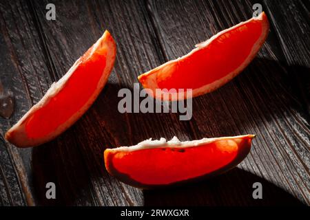 sliced grapefruit on wood background Stock Photo