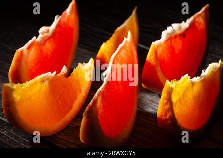 sliced grapefruit orange on wood background Stock Photo