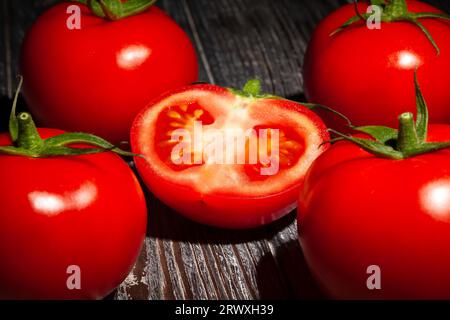sliced tomato on wood background Stock Photo