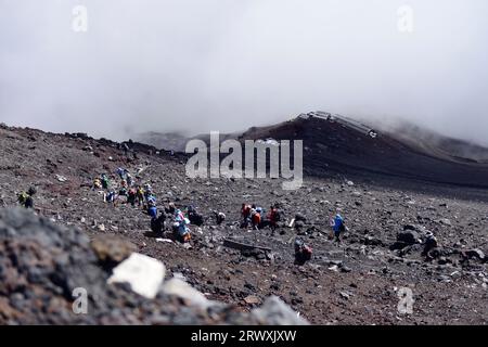 Climbers and mountain lodge from the summit of Mt. Fuji Stock Photo