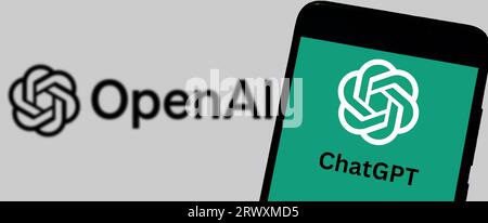 Buenos Aires, Argentina; 08-31-2023: Logo of Chat GPT on smartphone screen and Open AI in the background. Stock Photo