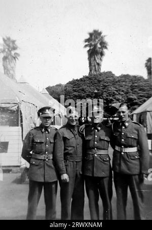A group of four soldiers at Santa Monica Rest Camp. Rare photograph: From a collection compiled by an unknown British serviceman covering the No. 1 Composite Demonstration, AA Battery, tour of the USA, from July 11th 1943. This is one from over one hundred images in the collection which were on average around 4x3 inches. Stock Photo