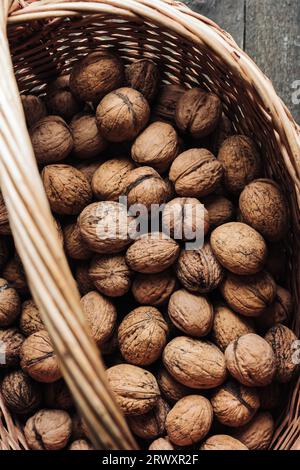 Freshly harvested walnuts in a basket. Stock Photo