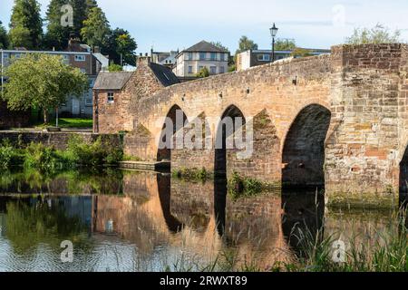 Devorgilla Bridge (or Old Bridge) is one of Scotland's oldest standing bridges. It spans the River Nith in Dumfries Stock Photo