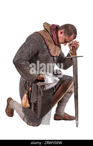 Norman Knight 2nd half of the 11th centuries praying. Isolated on white Stock Photo
