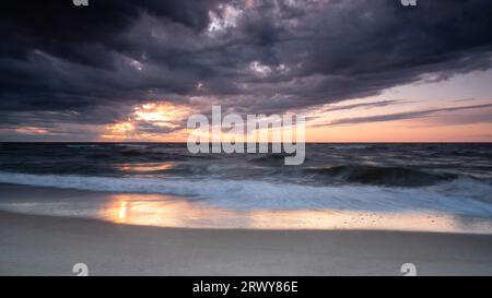 sunset over the sea, long exposure, dramatic sky Stock Photo