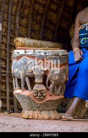 Closeup of a large traditional Zulu Drum with elephant carvings, Durban, South Africa Stock Photo