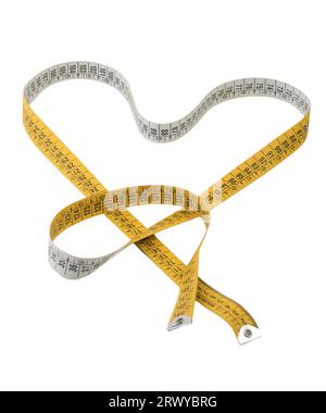 a heart formed with a tape measure on a transparent surface Stock Photo